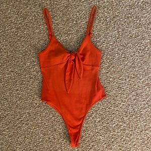 Orange bodysuit